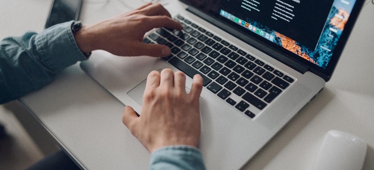 agency member working on a laptop