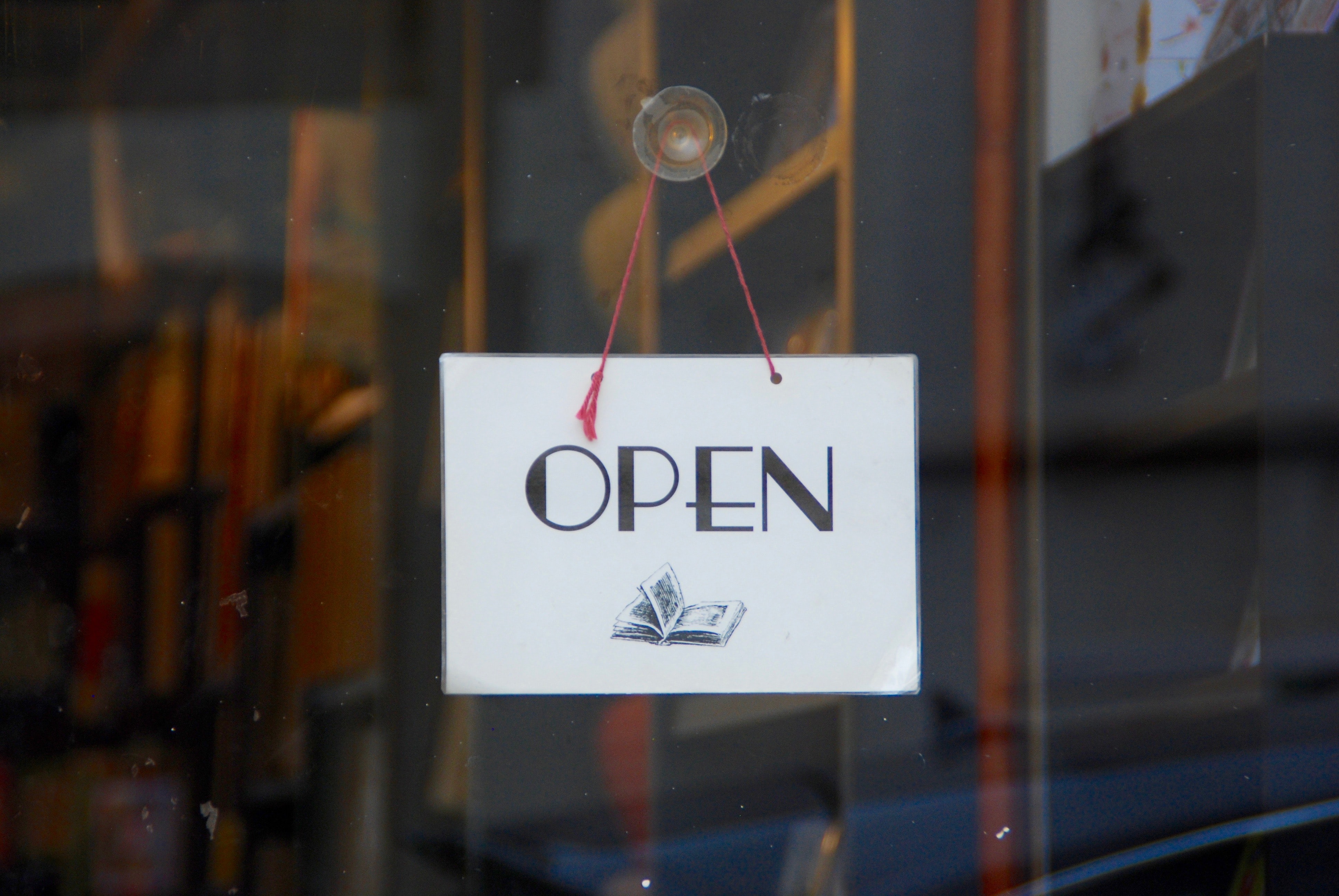 open sign on a book shop storefront