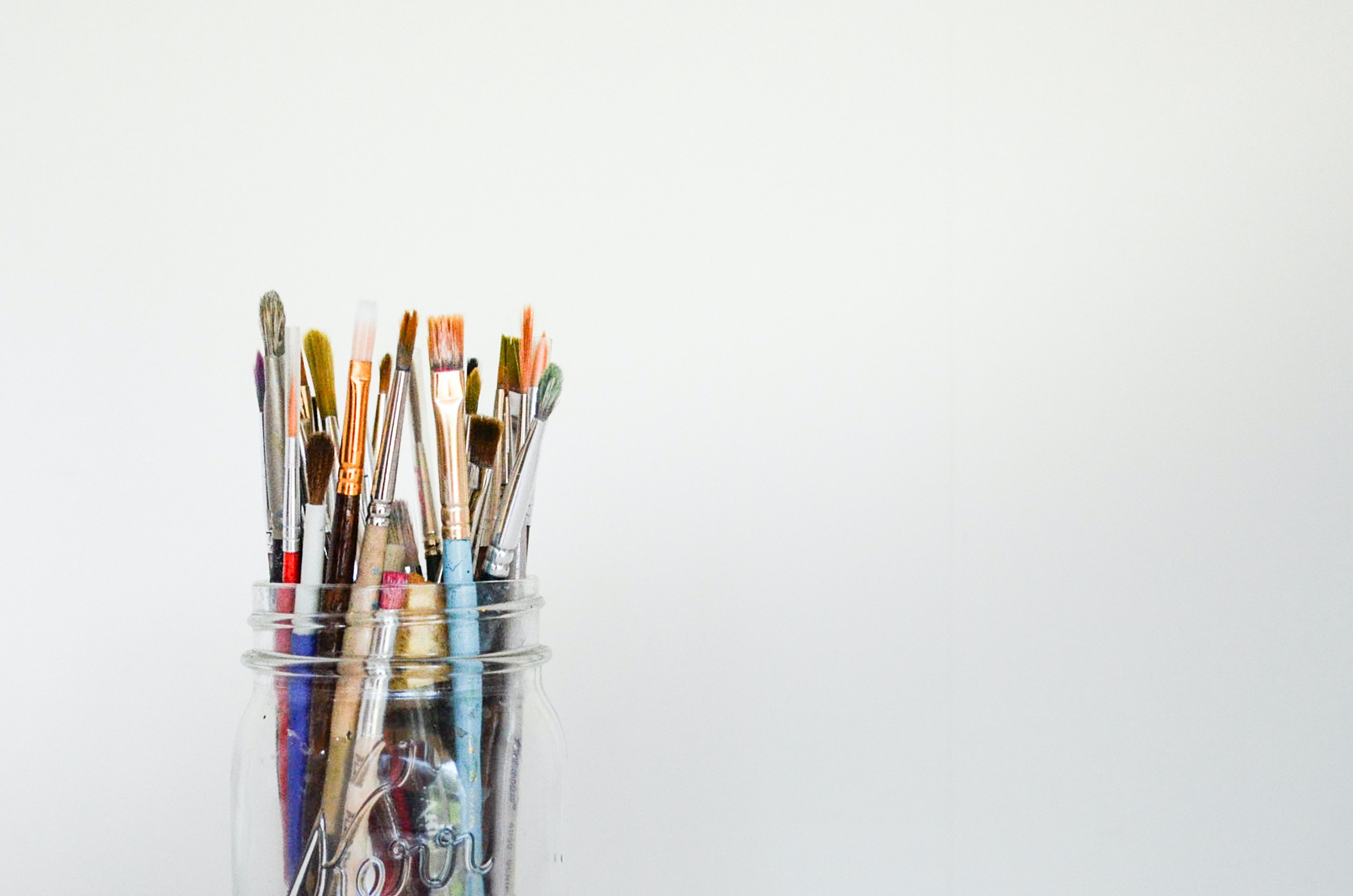 mason jar of paint brushes