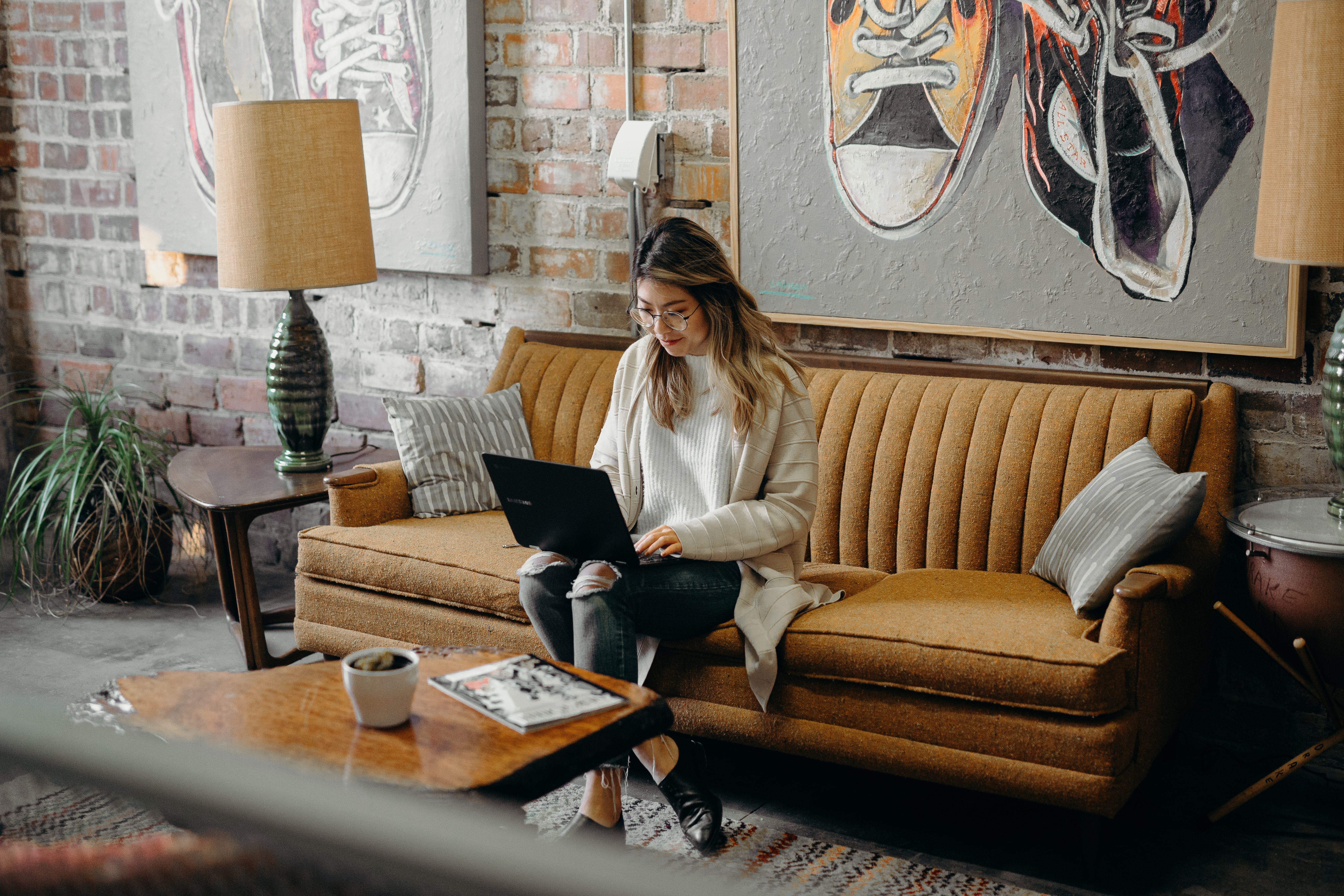 Woman on couch planning 
