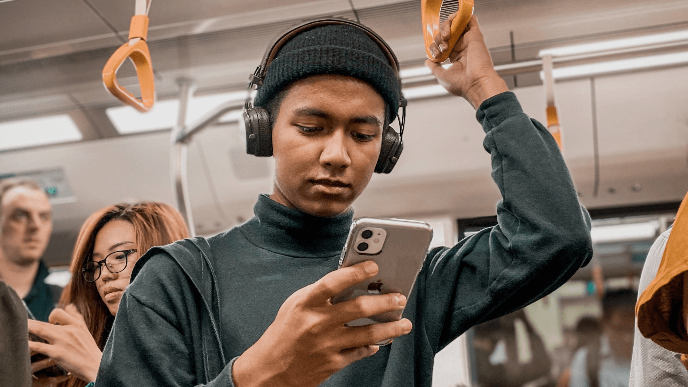 man on phone on subway