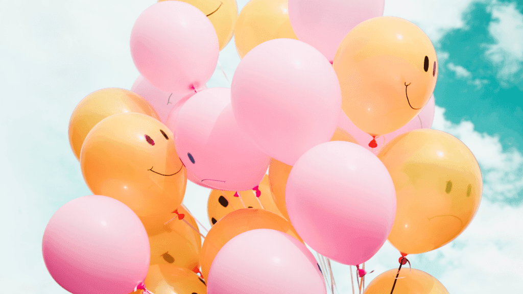 smiley face sad face balloons