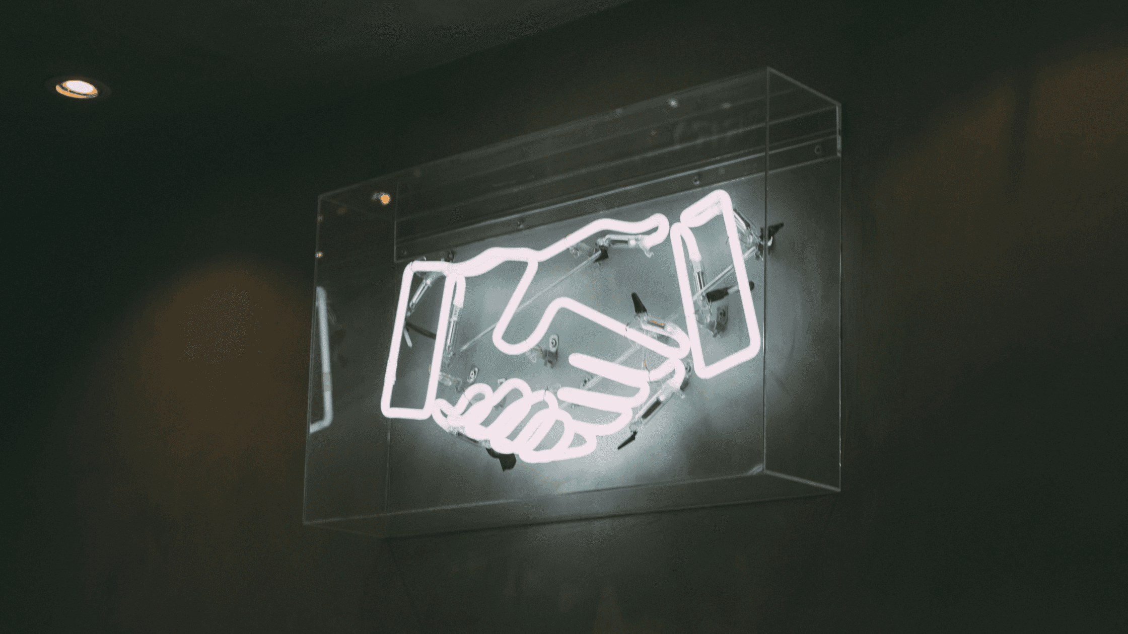 shaking hands neon light