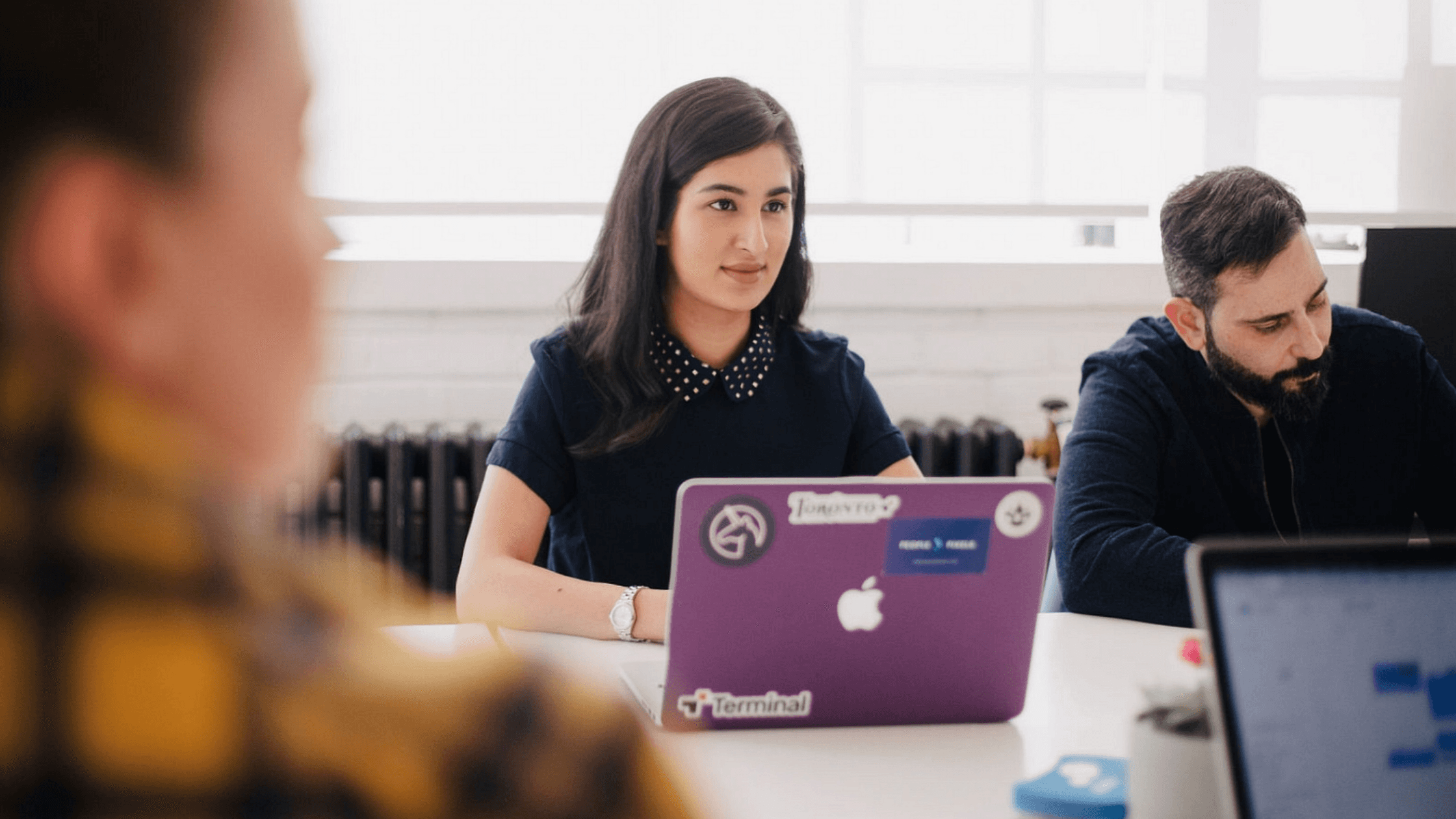 woman in meeting with laptop