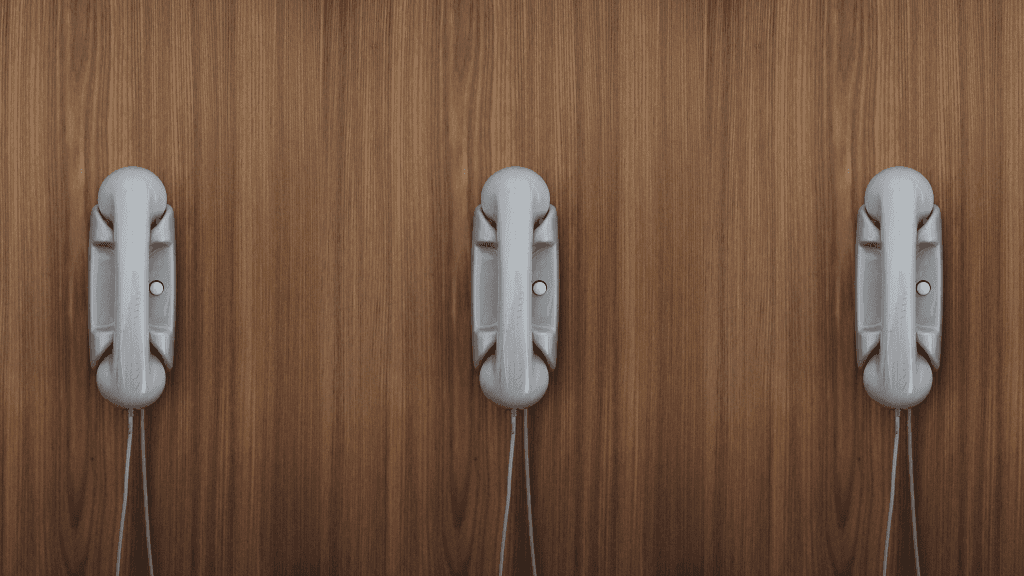 phones on a wooden wall customer support 